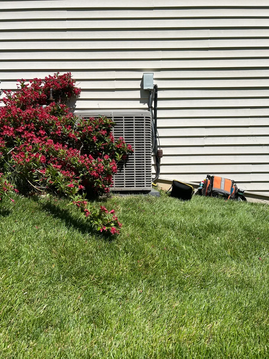 Existing outdoor air conditioner at a Lake St. Louis replacement project before installation.