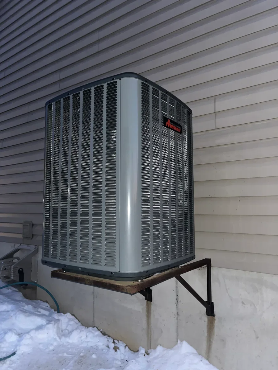 Completed air conditioner replacement on the same wall bracket in O'Fallon.