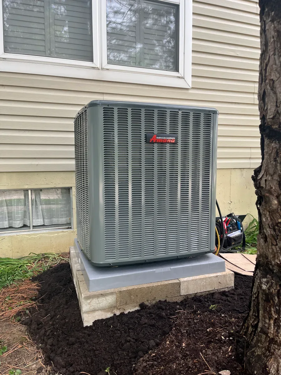 Completed outdoor air conditioner replacement on the same St. Charles equipment pad.