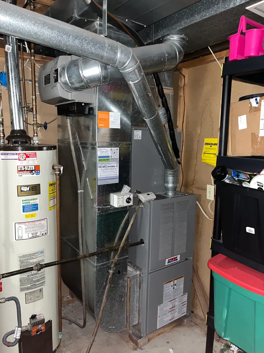 Existing furnace and ductwork before replacement at a St. Peters property.