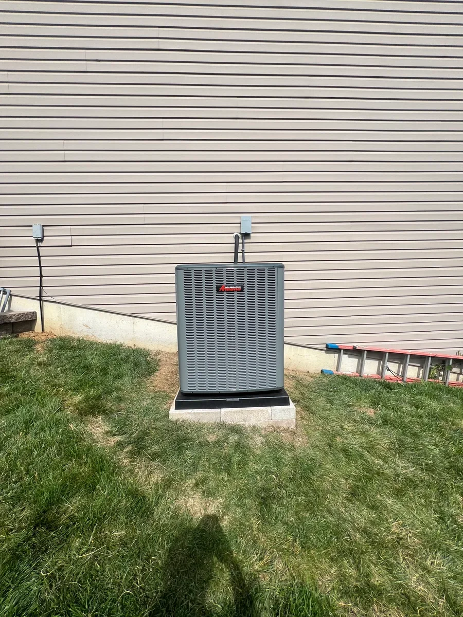 Completed air conditioner replacement with the same service lines visible in Wentzville.